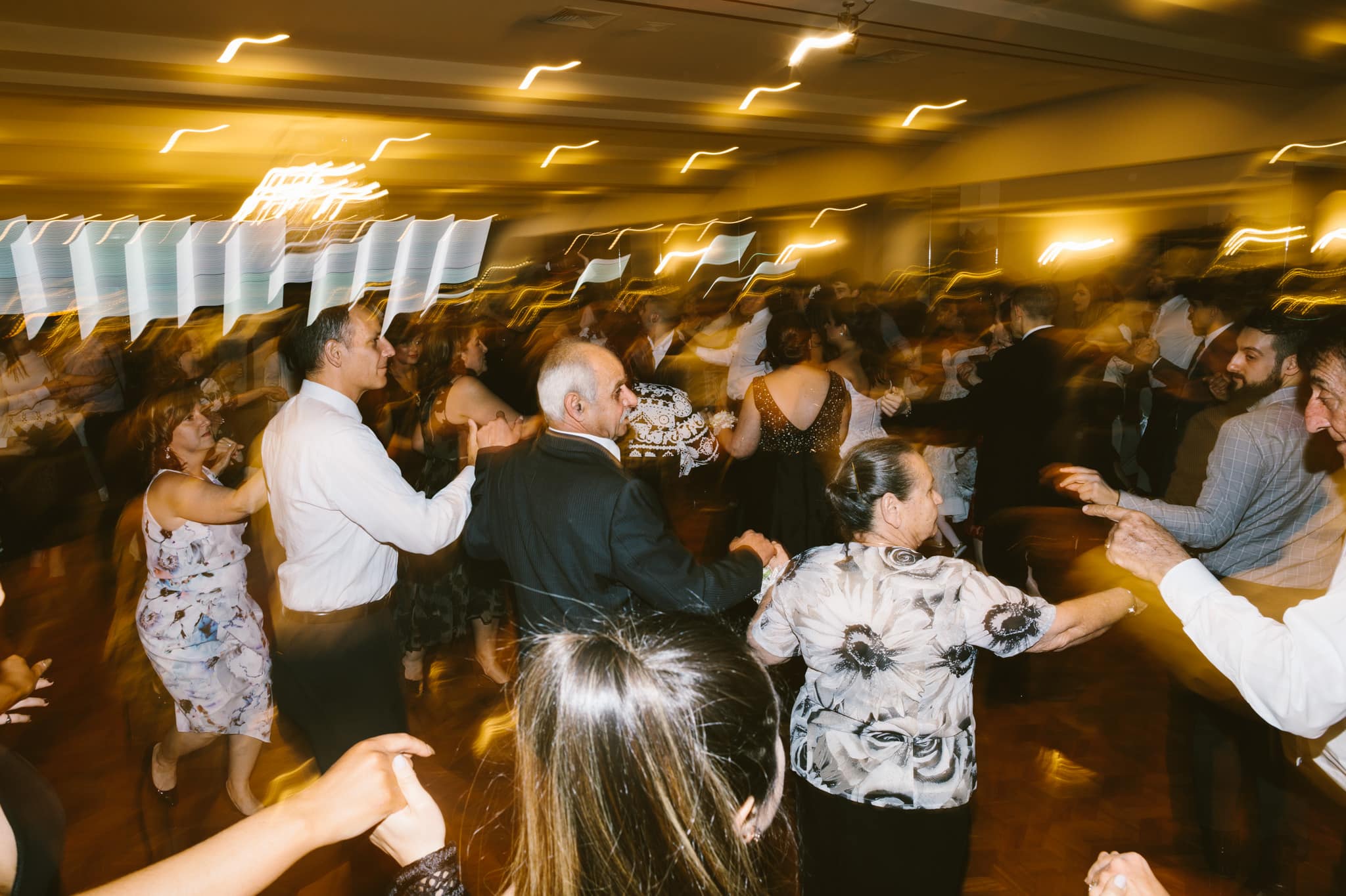 large greek wedding - photography of wedding dance - greek dancing - fun