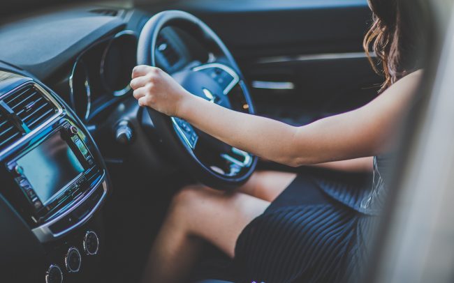 girl sitting in the drivers seat - mini skirt - lifestyle photos